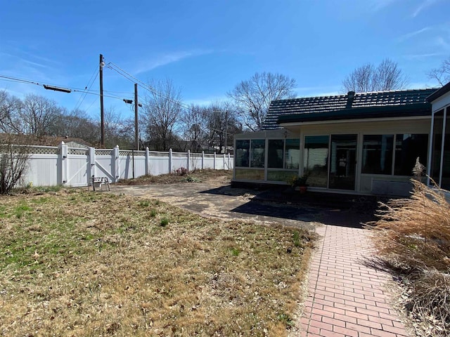 view of yard featuring a sunroom