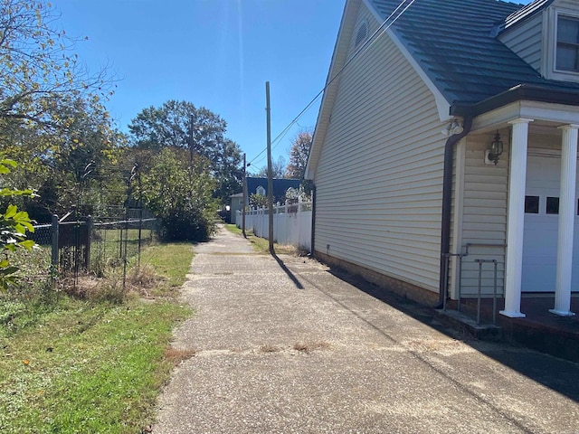 view of side of property with a garage