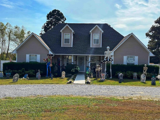 view of front of home featuring a porch and a front yard