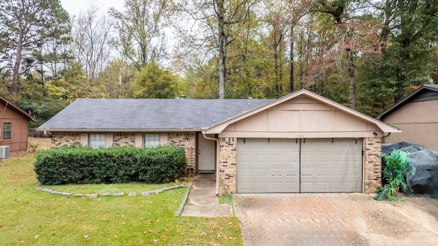 ranch-style house featuring cooling unit, a front lawn, and a garage