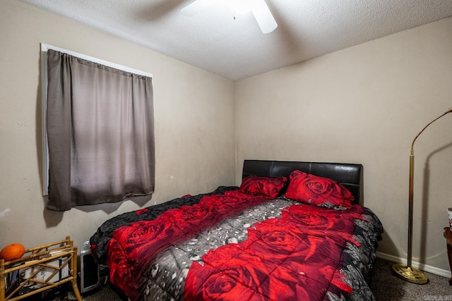 carpeted bedroom with a textured ceiling and ceiling fan