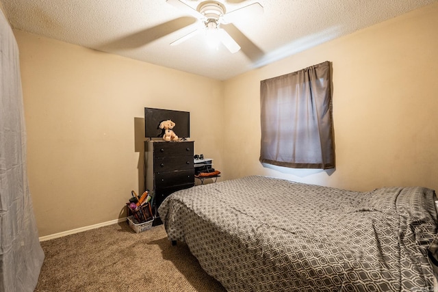 carpeted bedroom with a textured ceiling and ceiling fan