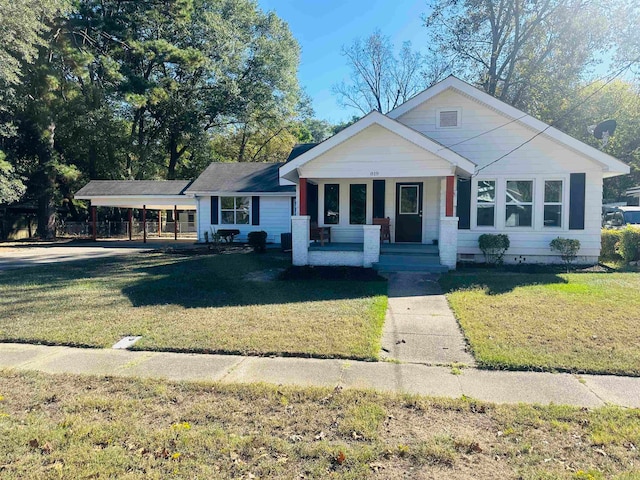 view of front of home featuring covered porch and a front yard