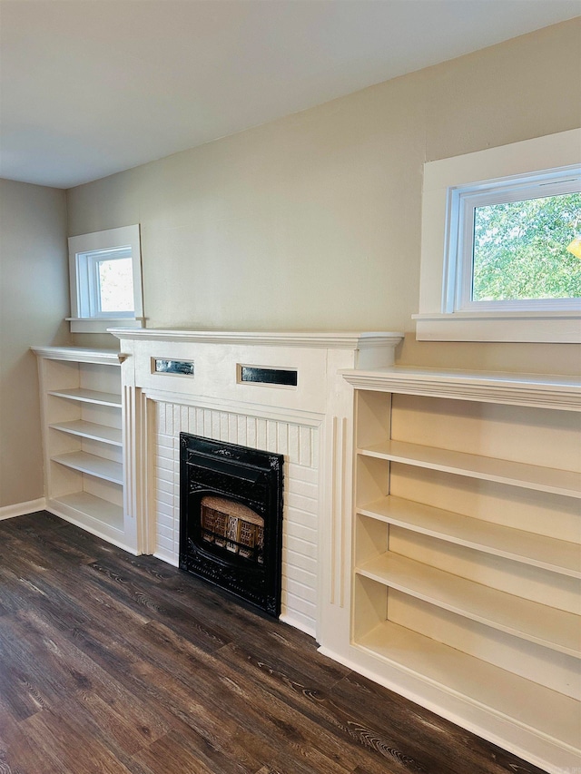 room details with hardwood / wood-style flooring and a brick fireplace