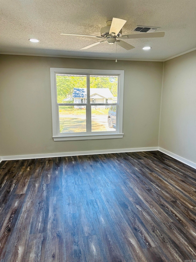 empty room with ceiling fan, a textured ceiling, and dark hardwood / wood-style flooring