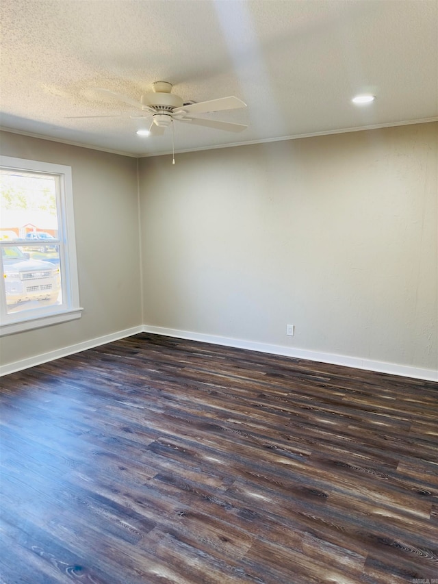 spare room with dark wood-type flooring, crown molding, a textured ceiling, and ceiling fan