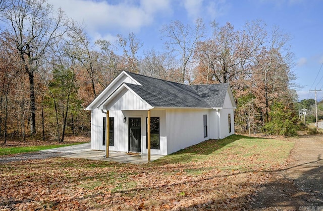 view of side of home with a patio area