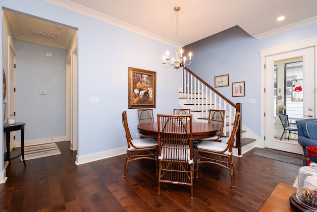 dining room featuring ornamental molding, dark hardwood / wood-style flooring, and a chandelier