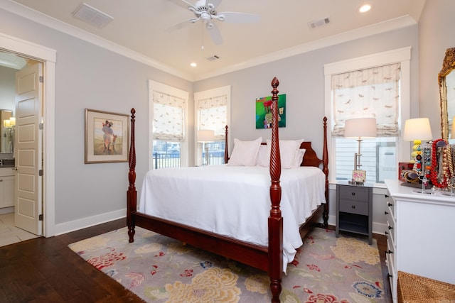 bedroom featuring crown molding, light hardwood / wood-style flooring, ensuite bathroom, and ceiling fan