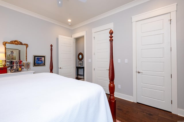 bedroom featuring dark wood-type flooring, crown molding, and ceiling fan