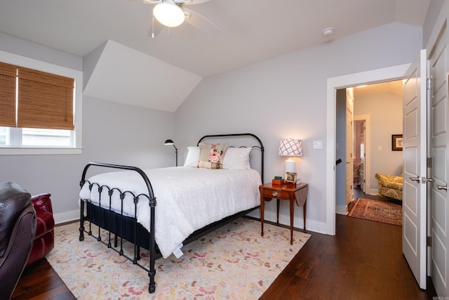 bedroom featuring ceiling fan, vaulted ceiling, and dark hardwood / wood-style floors