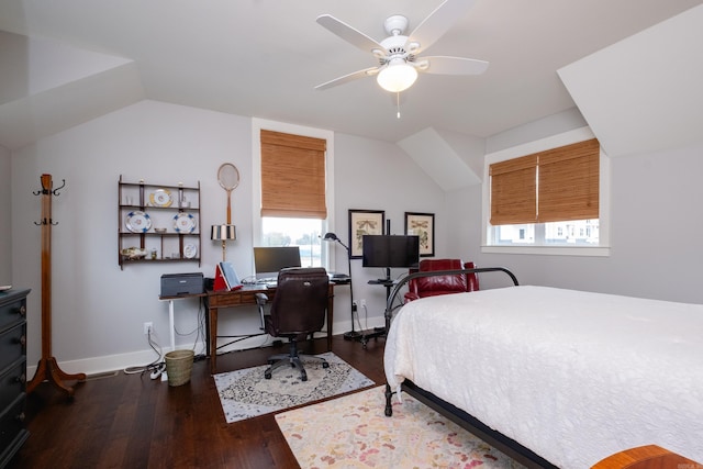 bedroom with dark wood-type flooring, ceiling fan, and vaulted ceiling