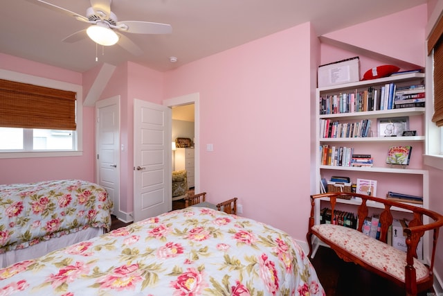 bedroom featuring hardwood / wood-style flooring and ceiling fan