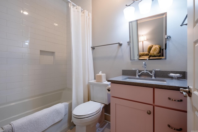 full bathroom featuring vanity, toilet, and shower / tub combo with curtain