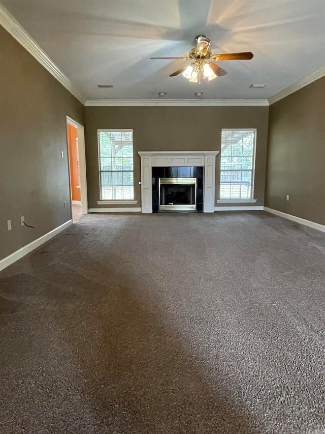 unfurnished living room with carpet, plenty of natural light, and crown molding