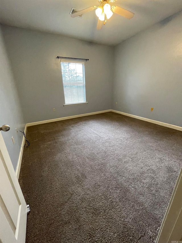 empty room with ceiling fan and carpet floors