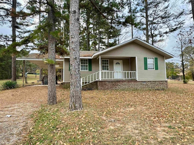 ranch-style house with covered porch