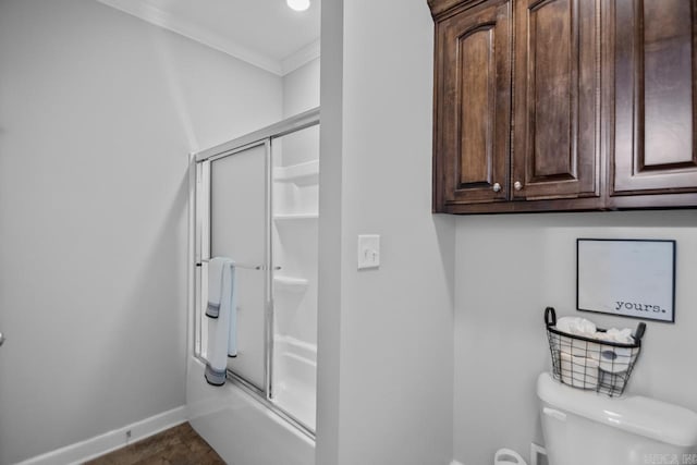 bathroom with toilet and ornamental molding