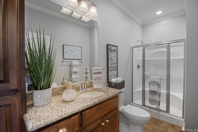 bathroom with a shower with door, toilet, vanity, crown molding, and tile patterned floors