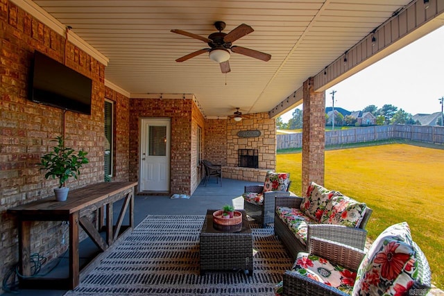 view of patio / terrace with an outdoor living space and ceiling fan