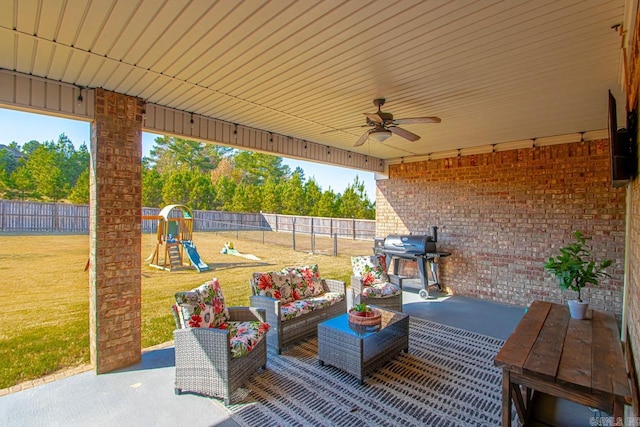 view of patio with a playground and grilling area