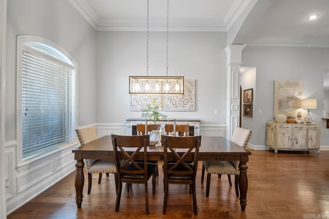 dining area with ornate columns, ornamental molding, and dark hardwood / wood-style floors