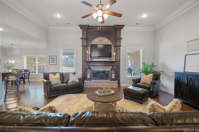 living room featuring a wealth of natural light, hardwood / wood-style floors, and crown molding