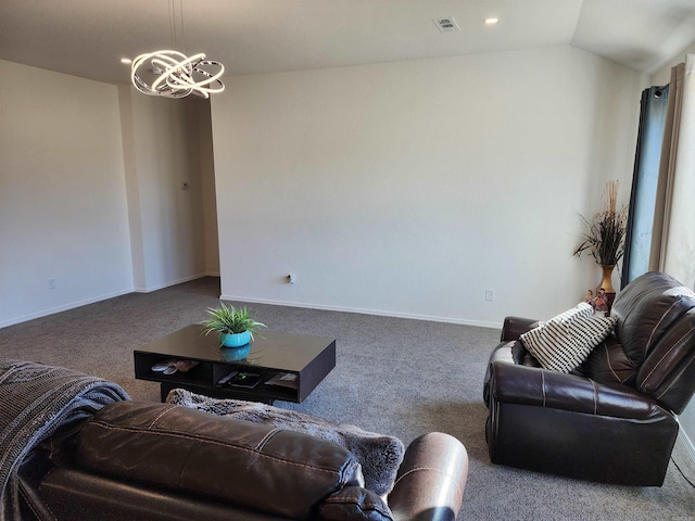 living room featuring a chandelier, vaulted ceiling, and carpet flooring