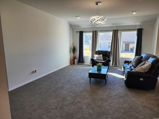 living room with an inviting chandelier, lofted ceiling, and dark carpet