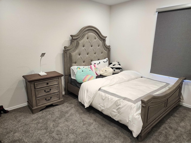 bedroom with dark colored carpet