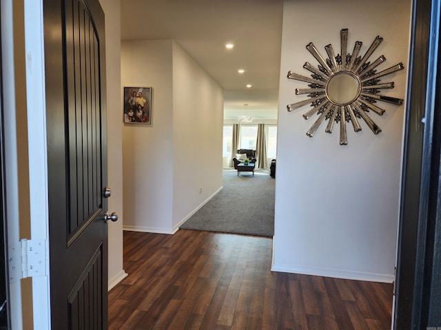 hallway with dark wood-type flooring