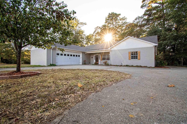 single story home featuring a garage