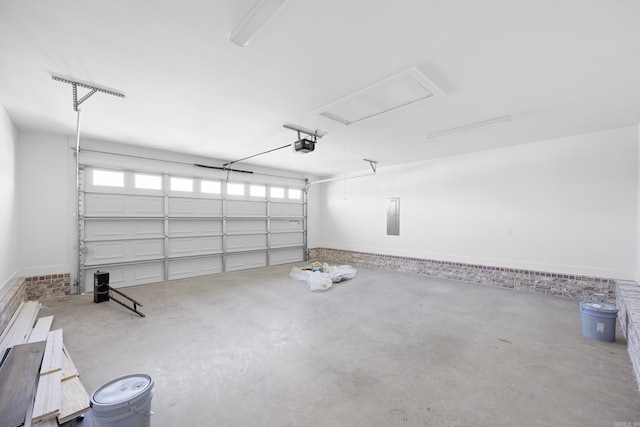 garage with electric panel and a garage door opener