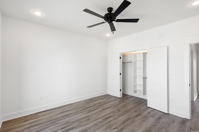 unfurnished bedroom with baseboards, dark wood-style floors, ceiling fan, a closet, and recessed lighting