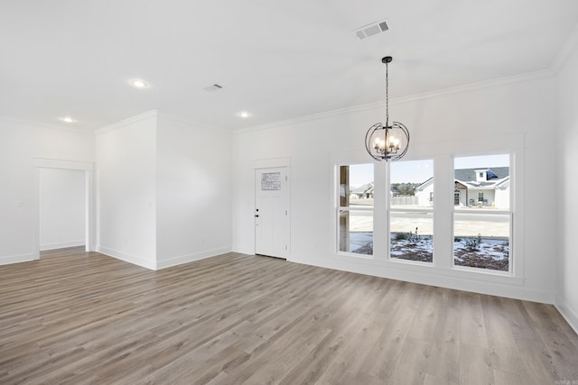 entrance foyer featuring a chandelier, visible vents, baseboards, light wood-type flooring, and crown molding