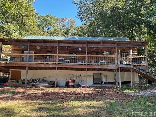 back of property with a wooden deck