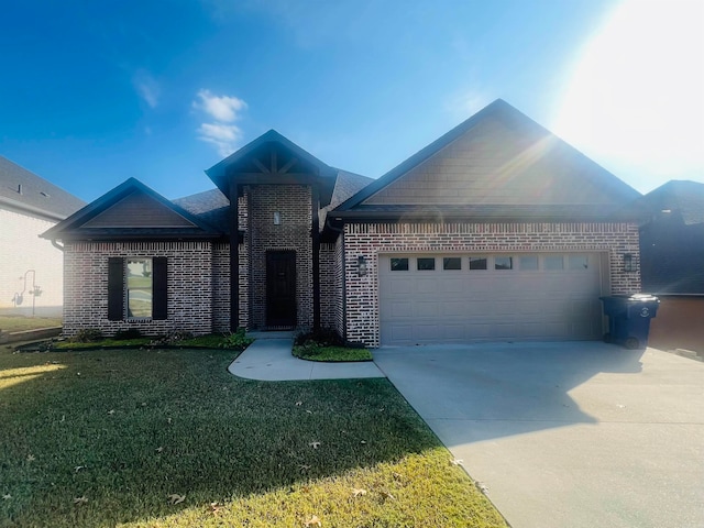 view of front of home with a garage and a front lawn