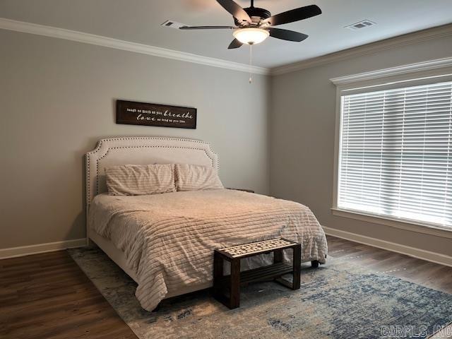 bedroom with ceiling fan, dark hardwood / wood-style floors, and crown molding