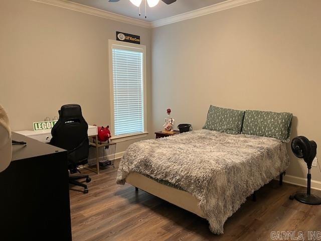 bedroom featuring hardwood / wood-style floors, ceiling fan, and ornamental molding