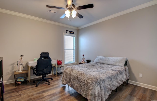 bedroom featuring ornamental molding, dark wood-type flooring, and ceiling fan