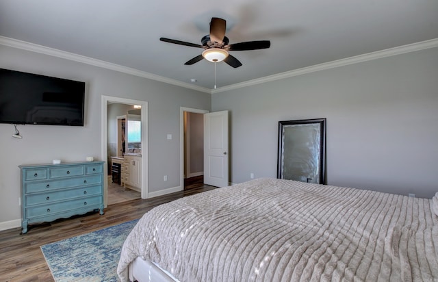 bedroom with crown molding, light hardwood / wood-style flooring, ceiling fan, and ensuite bath