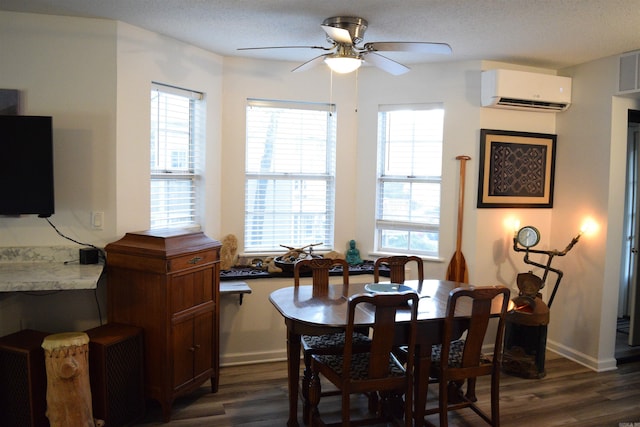 dining room with ceiling fan, a textured ceiling, a wall mounted AC, and dark hardwood / wood-style flooring