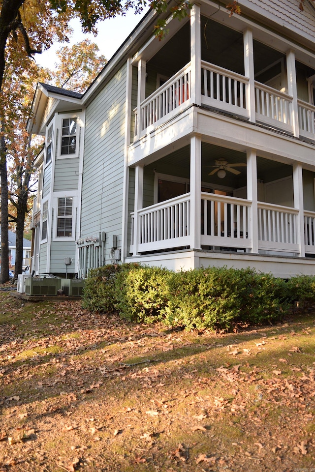 view of side of home featuring a balcony