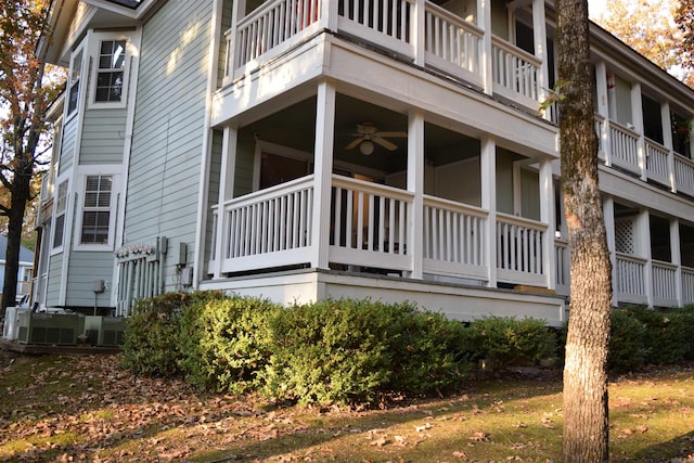 view of home's exterior featuring central air condition unit, ceiling fan, and a balcony