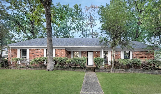 single story home with a front yard