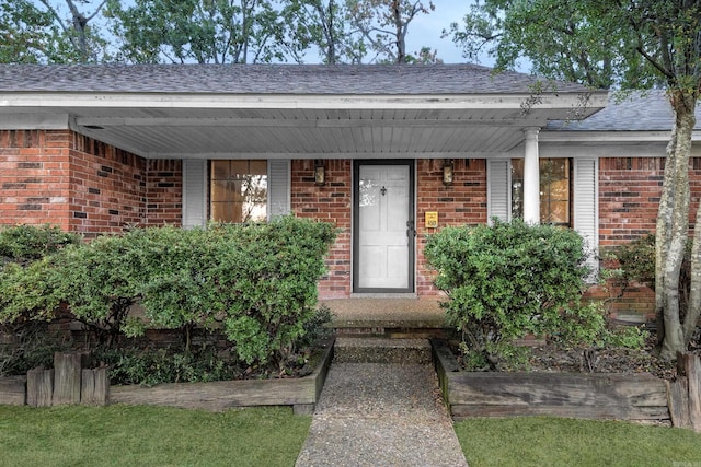 entrance to property with a porch