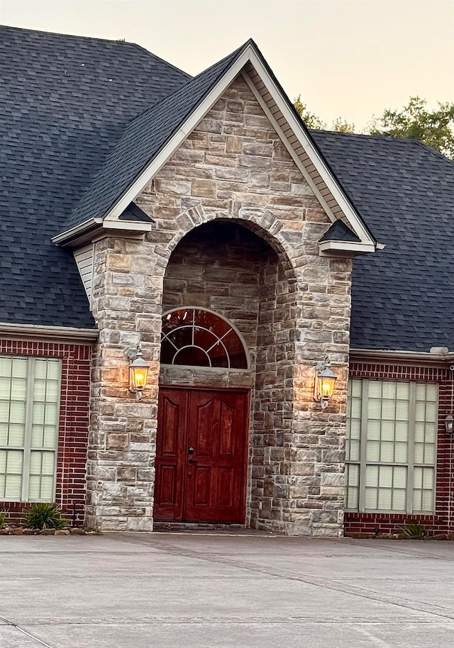 view of exterior entry at dusk