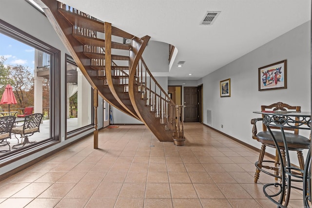 interior space with tile patterned flooring and plenty of natural light