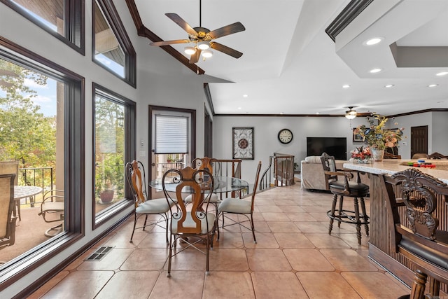 dining area featuring crown molding, ceiling fan, and light tile patterned floors