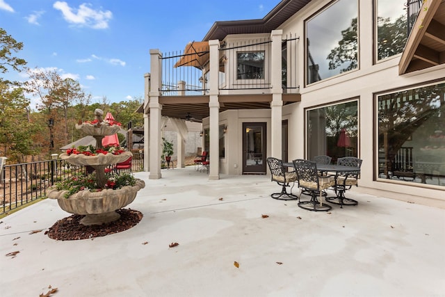 view of patio featuring a balcony